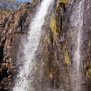 036_TZmN.7718V-Man-Under-Waterfall-N-Zambia