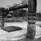 026_CZmA.8341BW-African-Village-Woman-&-Carved-Water-Well-NW-Zambia