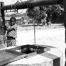 027_CZmA.8548BW-African-Village-Girl-&-Carved-Water-Well-NW-Zambia