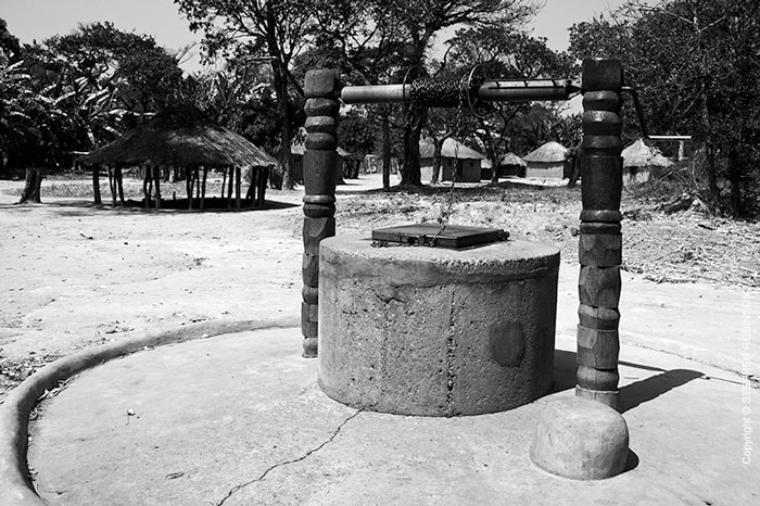 033_CZmA.8759BW-African-Carved-Water-Well-&-Remote-Village
